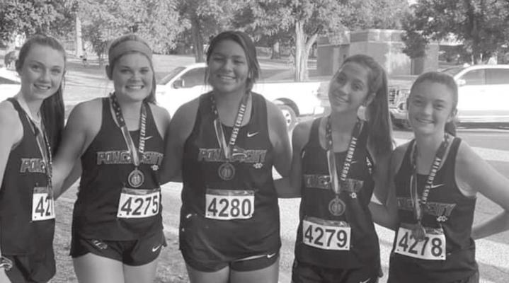MEDALISTS IN the Oklahoma 7 Conference girls 5K varsity race include Ponca City runners, from left, Julia Looper, Kennedy Brown, Ryanna Sylestine, Emma Steichen and Lorin Scott. The meet was held in Bethany Thursday.