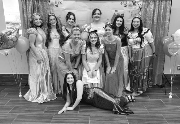 THE COSMETOLOGY students at Pioneer Tech recently spread magical cheer by hosting a special “Pampered by a Princess” event in partnership with Marland’s Place. Pictured left to right back row Jessica Juhl, Andi Massey, Danielle Hopkins, Kayla Randol (instructor), Andrea Esparza, and Yosselyn Sandoval. Middle row left to right Ali Carpenter, (Photographer and Newkirk Teacher), Piper Jones, Sarah Grayson, and Hope Henderson in the front. (Photo provided)