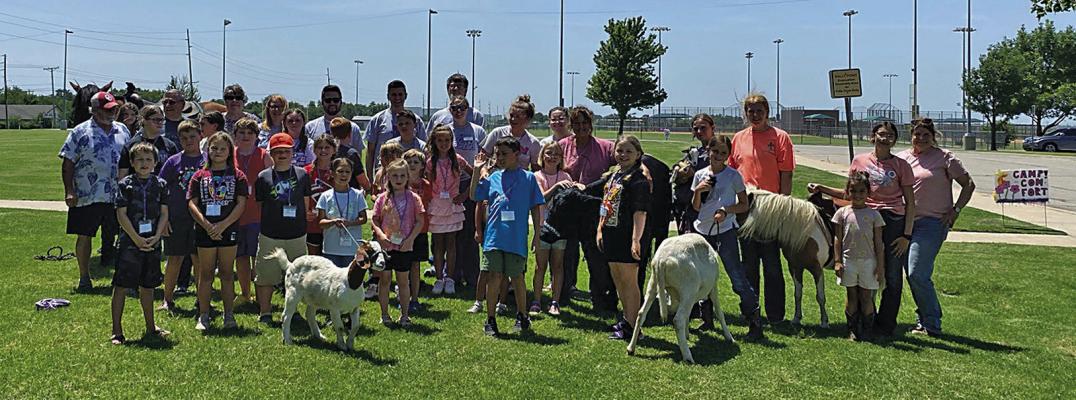 CAMP COMFORT was held at the Ponca City RecPlex on Tuesday, July 18. The program utilizes various forms of therapy including art, music and animals to help children learn coping skills and process grief and loss. Animals for the event were provided by the New Life Trails. (Photo Provided)