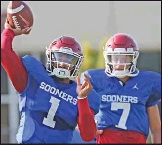 OKLAHOMA QUARTERBACK Jalen Hurts (1) throws as quarterback Spencer Rattler watches during the team’s Aug. 3 practice in Norman. Oklahoma coach Lincoln Riley has chosen Hurts as his starting quarterback for the Sept. 1 season opener against Houston over Rattler and Tanner Mordecai. (AP Photo)