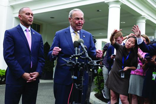 U.S. SENATE Majority Leader Charles Schumer (D-NY) and House Minority Leader Hakeem Jeffries (D-NY) speak to reporters after meeting with President Joe Biden and fellow congressional leaders at the White House on May 16, 2023, in Washington, D.C. The Democratic and Republican leaders were meeting to strike a deal on raising the debt limit and avoid a default by the federal government. (Alex Wong/Getty Images/TNS)