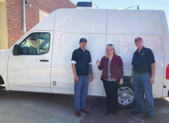 ERIN LIBERTON, NERA Board Member hands over the keys to the new van with a refrigerated unit to NERA employees, Stacy Faulkner, NERA Warehouse Manager and pictured on the right is Tom Short, President and NERA Executive Director. This van will be their “grocery-getter.” NERA makes about 5-7 grocery store pickups a week and after months of searching, fundraising and donations NERA was able to purchase the van and pay for it in full.