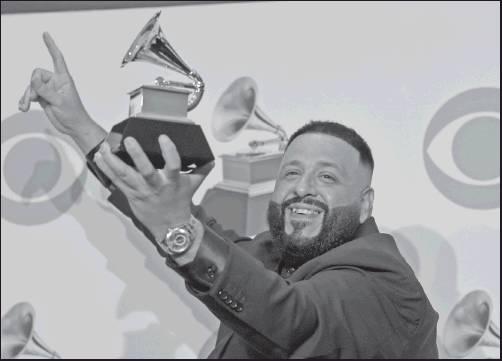 DJ KHALED poses in the press room with the award for best rap/sung performance for “Higher” at the 62nd annual Grammy Awards at the Staples Center on Sunday in Los Angeles. (AP Photo)