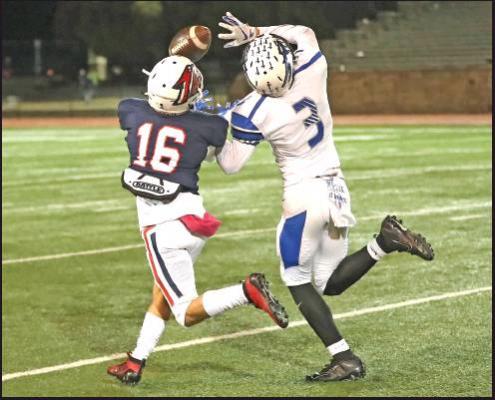 PONCA CITY’S Sam McKinney (16) and a Sapulpa defender vie for a pass thrown during Friday’s game in Suillins Stadium. McKinney scored one touchdown in the Wildcats’ 21-20 season ending victory. This photo was provided by Larry Williams.