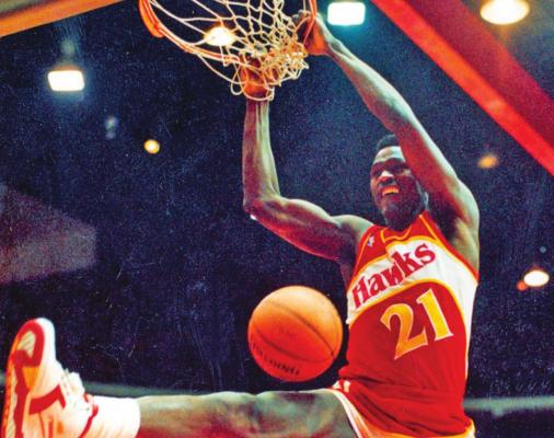 IN THIS FEB. 6, 1988 photo, Atlanta Hawks’ Dominique Wilkins follows through on a two-handed dunk during the All-Star Slam Dunk contest in Chicago. Michael Jordan left the old Chicago Stadium that night with the trophy. To this day, many believe Wilkins was the rightful winner. (AP Photo)