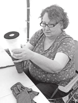 Rebecca Blakeburn, Ponca City, creates a gnome during the October Wheeler Dealers campout. (Photo by Kathy Tippin)
