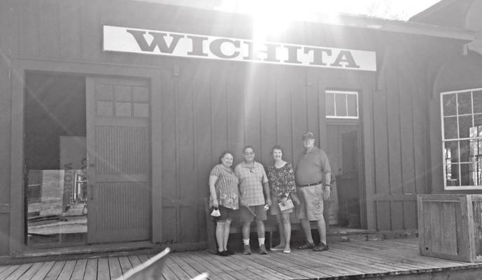 Ponca Citians Rebecca and Lowry Blakeburn and Barbara and John Davis tour Wichita’s Old Cowtown Museum. (Photo by Kathy Tippin)