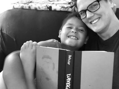 THE AUTHOR reads with her son.