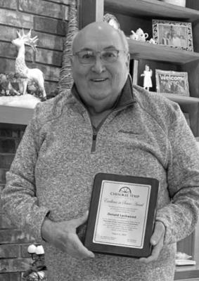 Donald Lockwood receives an Excellence in Service Award from Cherokee Strip Credit Union