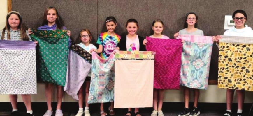 The 4-H Sewing Day Camp’s second day project was pillow cases, pictured left to right: MaCaila Schneeberger, Jacie Schneeberger, Aubrey Cobb, Kassidy Sheik, Piper Brandon, Cashlynn Smith, Karlie Sheik, Kaylee Cobb. (Photos by Lori Ann Evans)