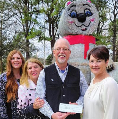 Brittany Federko (left), Katrina Jarvis (second from left) and Gay Washington (right) present Lou Anella with a check for $45,000 to the Horticulture Education Center Project, which will create a new building at The Botanic Garden at Oklahoma State University. (Photo provided by OSU Foundation)
