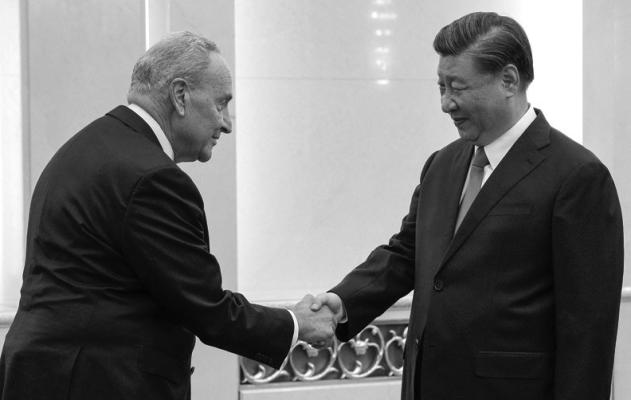 U.S. SENATE Majority Leader Chuck Schumer, left, is greeted by Chinese President Xi Jinping before their bilateral meeting at the Great Hall of the People in Beijing on Oct. 9, 2023. (Andy Wong/ Pool/AFP/Getty Images/TNS)