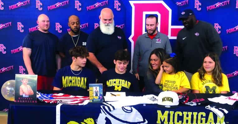 CHRISTOPHER KISER signed a letter of intent on Monday afternoon to wrestle at The University of Michigan. Congratulations! Photo provided.
