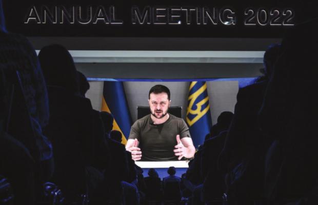 Ukrainia’s President Volodymyr Zelenskyy appears on a giant screen during his address by video conference as part of the World Economic Forum (WEF) annual meeting in Davos on May 23, 2022. (Fabrice Coffrini/AFP/Getty Images/TNS)