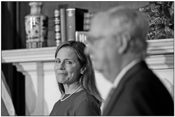 Seventh U.S. Circuit Court Judge Amy Coney Barrett, left, President Donald Trump’s nominee for the U.S. Supreme Court, meets with Senate Majority Leader Mitch McConnell (R-KY) as she begins a series of meetings to prepare for her confirmation hearing, on Capitol Hill in Washington, D.C., on Tuesday, Sept. 29, 2020. (Susan Walsh/Pool/Getty Images/TNS)