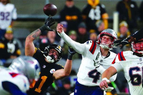 QUARTERBACK BAILEY Zappe (4) of the New England Patriots throws a pass in the first half against the Pittsburgh Steelers at Acrisure Stadium on Thursday, Dec. 7, 2023, in Pittsburgh. (Justin K. Aller/Getty Images/TNS)