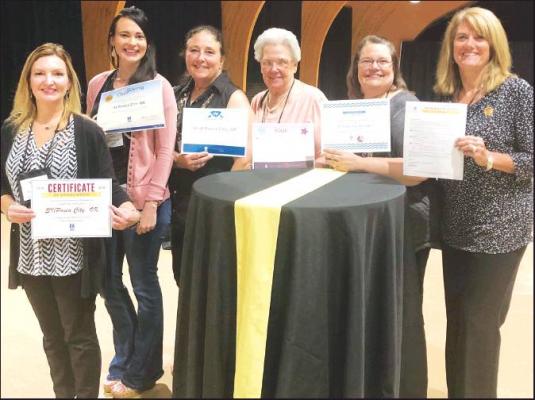 SIX AWARDS were presented to Soroptimist International of Ponca City at their annual Fall Region Meeting. Accepting them were from left Tracy Ogden, Heather Sumner, Terri Buesing, Dorothy Dewan, Deb Vap and Cindy Wigley.