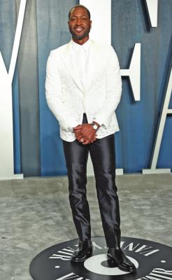 DWAYNE WADE arrives at the Vanity Fair Oscar Party on Feb. 9 in Beverly Hills, Calif. Wade’s number is being retired by the Miami Heat. (AP Photo)