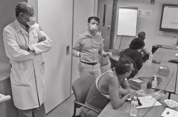 Dr. Vladimir Berthaud and Dr. Rajbir Singh recruit patients for a COVID-19 vaccine trial at Meharry Medical College in Nashville, Tennessee. (Blake Farmer/Nashville Public Radio/KHN/TNS)
