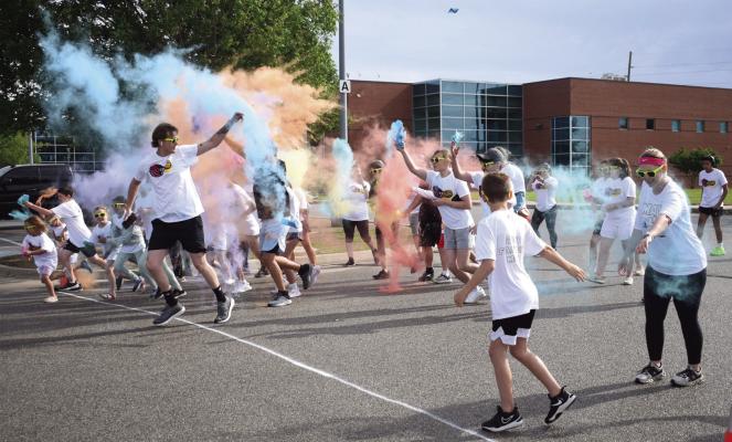 A large crowd gathered at the Ponca City RecPlex Saturday morning, May 4 for the fourth annual Color Run 5K and mile run. Families enjoyed the cool spring morning together and were covered in a variety of colors to celebrate the community. (Photos by Everett Brazil, III)