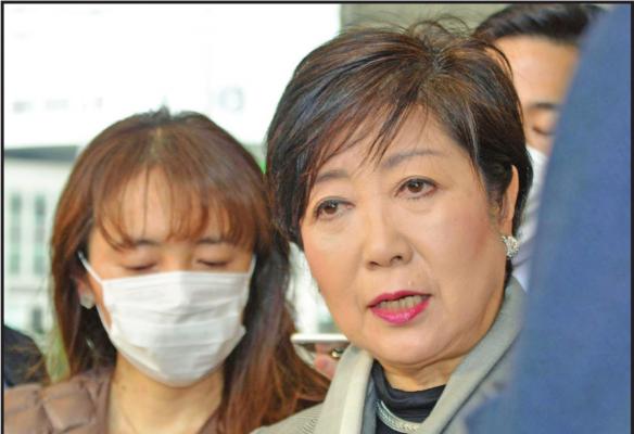 TOKYO GOV. Yuriko Koike, right, answers a reporter’s question about the latest policy of International Olympic Committee, at Tokyo Metropolitan Government in Tokyo Monday. The IOC will take four weeks to weigh options for the Tokyo Games amid mounting calls from athletes and Olympic officials for a postponement due to the coronavirus pandemic. (AP Photo)