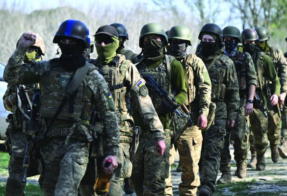 MEMBERS OF the Siberian battalion within the Ukrainian Armed Forces take part in a military training exercise on a shooting range in Kyiv region on April 10, 2024, amid the Russian invasion of Ukraine. (Genya Savilov/AFP via Getty Images/TNS)