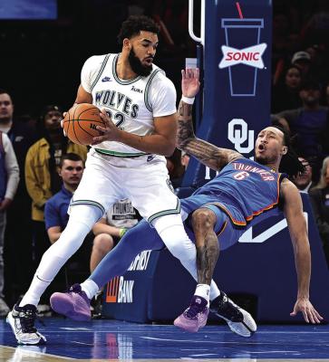 KARL-ANTHONY TOWNS (32) of the Minnesota Timberwolves backs into Jaylin Williams (6) of the Oklahoma City Thunder during the first half at Paycom Center on Monday, Jan. 29, 2024, in Oklahoma City, Oklahoma. (Joshua Gateley/Getty Images/TNS)