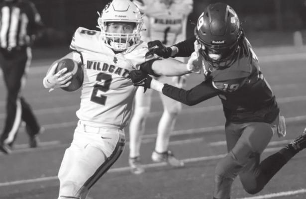 PONCA CITY running back Blake Bristow (2) fends off a Muskogee tackler during Friday’s game in Muskogee. Bristow carried the ball 40 times to gain 236 yards as the Wildcats won 35-28. This photo was provided by Justin Boyer.