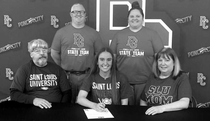 SARAH DINGUS of Ponca City has signed a letter of intent to swim at Saint Louis University, a NCAA Division I program. With her at the signing are family members and Ponca City coaches.