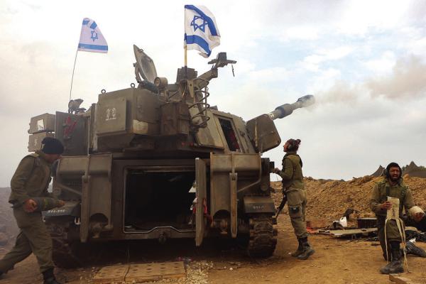 AN ISRAELI artillery unit is pictured near the border with the Gaza Strip on Dec. 5, 2023, amid continuing battles between Israel and the militant group Hamas. (Gil Cohen-Magen/ AFP via Getty Images/TNS)