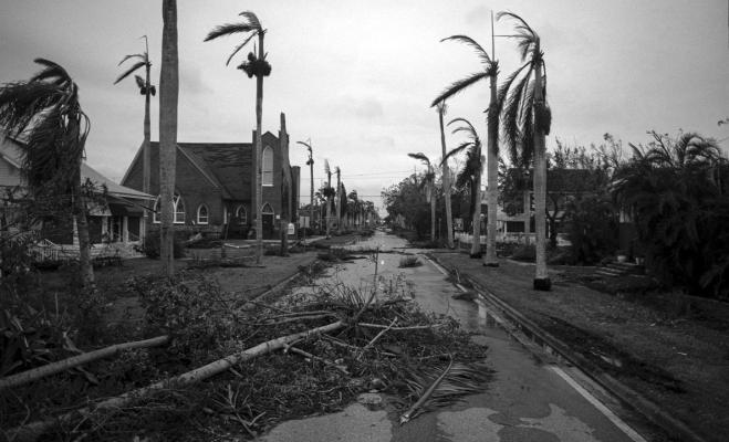 Debris litters a street in the aftermath of Hurricane Ian in Punta Gorda, Florida on September 29, 2022. - Hurricane Ian left much of coastal southwest Florida in darkness early on Thursday, bringing “catastrophic” flooding that left officials readying a huge emergency response to a storm of rare intensity.