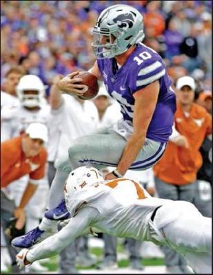 KANSAS STATE quarterback Skylar Thompson (10) is tackled by Texas’ Caden Sterns (7) after scrambling for a first down in a 2018 college football game in Manhattan, Kan. The Wildcats will bring a 3-0 record to Stillwater Saturday for their opening Big 12 game (AP Photo)