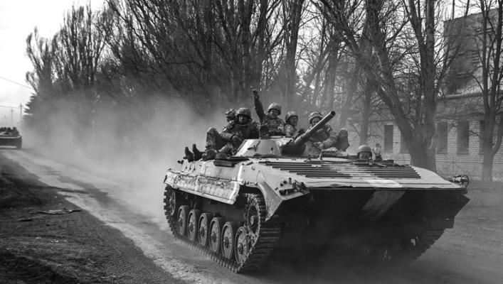 Ukrainian servicemen head toward Bakhmut in a BMP infantry fighting vehicle, in eastern Ukraine on March 22, 2023. (Aris Messinis/
