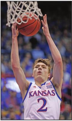 KANSAS GUARD Christian Braun (2) makes a basket after a steal during the first half of a basketball game against Iowa State in Lawrence, Kan., Monday. Kansas won the game 81-61. Story on Page 8. (AP Photo)