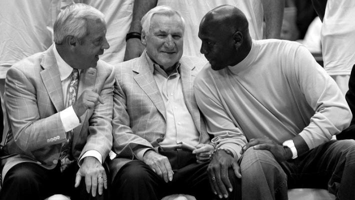 ROY WILLIAMS, left, and his mentor Dean Smith, center, visit with basketball great Michael Jordan. Williams took Kansas and North Carolina teams to the Final Four almost as often as Smith had done during his career at North Carolina. Jordan played his college ball at North Carolina.