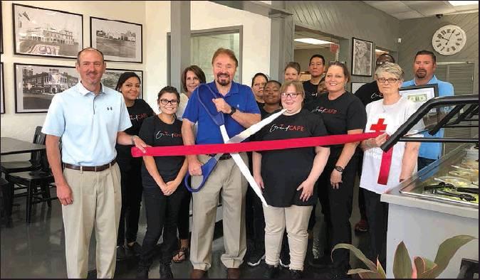 A RIBBON CUTTING ceremony was held Tuesday morning at Ponca City’s newest eatery, The Grand Cafe, at the corner of Fifth Street and Grand Avenue. (News Photo by Mike Seals)