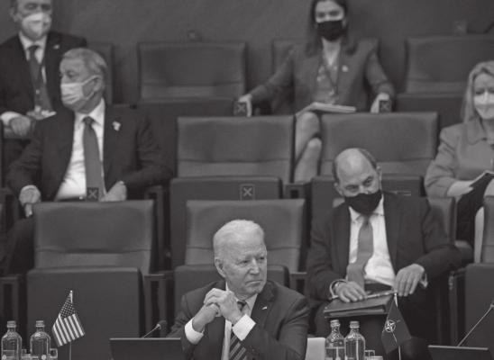 US President Joe Biden attends the meeting at the headquarters of the North Atlantic Treaty Organization (NATO) during a NATO summit in Brussels, on June 14, 2021. The 30-nation alliance hopes to reaffirm its unity and discuss increasingly tense relations with China and Russia, as the organization pulls its troops out after 18 years in Afghanistan. (Brendan Smialowski/ Pool/AFP via Getty Images/TNS)