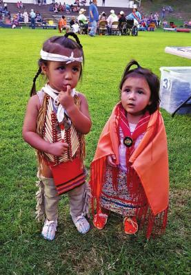 No event attracts a crowd like the Quapaw powwow, held every July 4 weekend. For 147 years running, thousands have gathered to celebrate the connection, language, culture, tradition and bright hope of the Quapaw Nation. Pictured are Jesse McKibben, son of Anna McKibben, and Isabella Vance, daughter of Kenadee Vance. (Photo credit Anna McKibben)