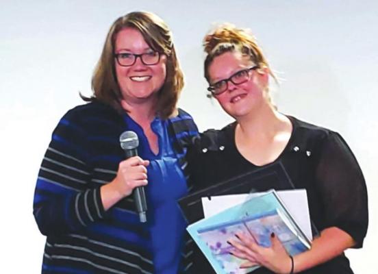 A graduation ceremony was held for Armindy Halverson, the very first Kay County Family Treatment Court graduate, on October 8, 2020. Pictured are Judge Jennifer Brock and Armindy Halverson (News photo provided by Bridgeway).