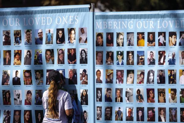 A WOMAN presses her face against a photo on a memorial poster during an event to raise awareness and funds for Didi Hirsch’s Suicide Prevention Center in Los Angeles in October 2023. (Allen J. Schaben/Los Angeles Times/TNS)