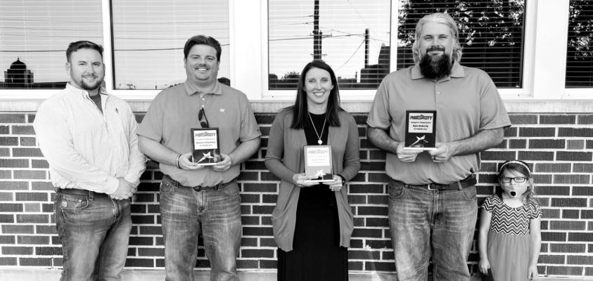 Pictured left to right: Garrett Bowers and J. Berry Harrison from Bowers Trucking; Jayme Evans, counselor at Po-Hi; and Kyle Moberly, district mechanic.