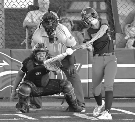 SAVANNAH CLARK of Ponca City puts bat on ball during the Lady Cats’ final home game against Midwest City Monday. Clark was honored at the game which was Senior Night. She was the only senior starter on the team. Ponca City defeated Midwest City 11-4 and then went on to defeat Bartlesville twice and lose to Jenks twice in the Class 6A Regional Tournament in Jenks Wednesday and Thursday. This photo was provided by Dr. John Holden.