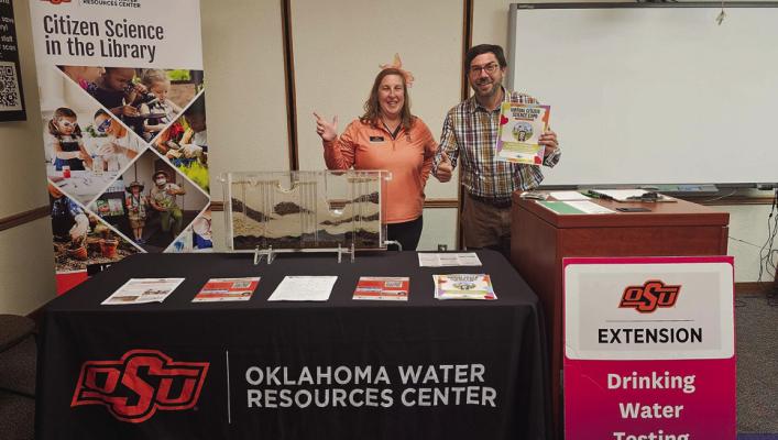 OKLAHOMA STATE University faculty member Nicole Colston (left) and Heath Stanfield, manager of McAlester Public Library, work a table at a rural library as part of the Oklahoma Well Owner Network. With a new grant, the program has expanded to include two water well screenings per year in seven rural counties. (Photo by OSU Agriculture)