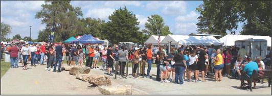 CROWDS GATHERED to taste the various BBQ offered by competitors at the 37th Annual Cherokee Strip Cook-Off held at Lake Ponca. (Photo by Calley Lamar)