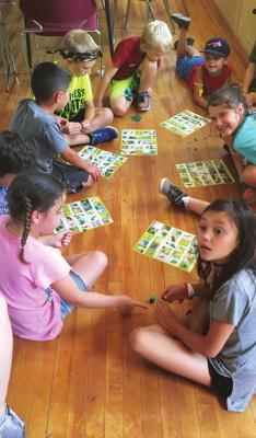 CRAFTS AND games like Bird Bingo are played during Day Camp to learn about nature at Camp McFadden.