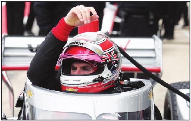 IN THIS FEB. 12, 2020, file photo, IndyCar driver Will Power lowers into his car as he prepares to drive in IndyCar Series testing, in Austin, Texas. The 2020 IndyCar season will open Saturday night, June 6, at Texas Motor Speedway. An already lengthy offseason has been stretched to more than eight months since IndyCar last raced and the first event back is at Texas’ high-speed oval where drivers will get their first test of a heavy new windshield designed to protect the cockpit. (AP Photo/Eric Gay, File)