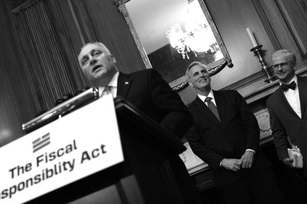 HOUSE SPEAKER Kevin McCarthy, R- Calif., center, smiles as House Majority Leader Steve Scalise, R- La., left, speaks at a press conference after the House approved H.R. 3746 - the Fiscal Responsibility Act on Capitol Hill in Washington, D.C., on May 31, 2023. (Yuri Gripas/ABACAPRESS.COM/TNS)