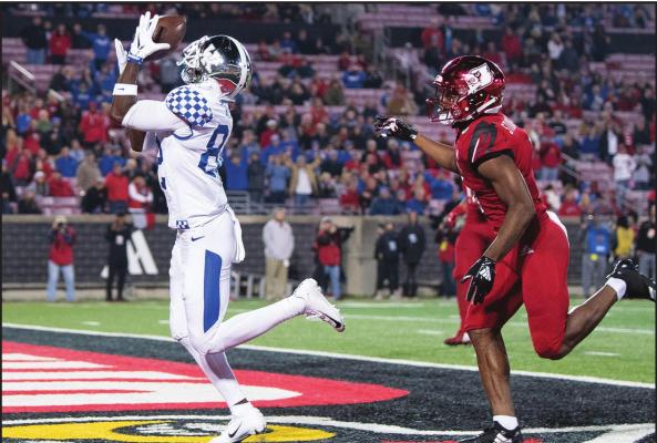 IN THIS NOV. 24, 2018, file photo, Kentucky wide receiver Josh Ali (82) catches a touchdown pass during the team’s NCAA college football game against Louisville in Louisville, Ky. The Southeastern Conference’s conference-only scheduling decision during the coronavirus pandemic wiped out any hopes of saving four in-state rivalries against Atlantic Coast Conference opponents, all traditionally played on the final Saturday of the regular season. (AP Photo/Bryan Woolston, File)