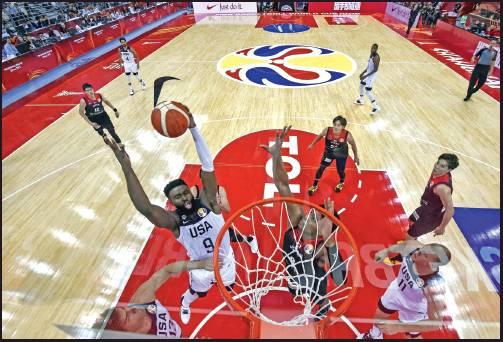 HARRISON BARNES, left, of the U.S. fights for the ball with Japan’s Rui Hachimura during the Basketball World Cup Group E game between US and Japan in Shanghai, China, Thursday. (AP Photo)