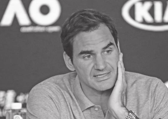 ROGER FEDERER of Switzerland speaks during a press conference following his semifinal loss to Serbia’s Novak Djokovic at the Australian Open tennis championship in Melbourne, Australia Jan. 30. Federer will miss some tournaments due to knee surgery. (AP Photo)